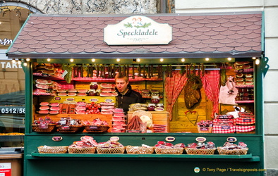 Christmas market stall selling cured meats